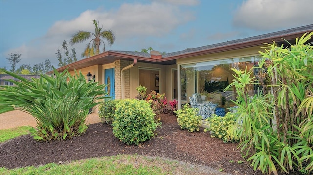 exterior space featuring brick siding