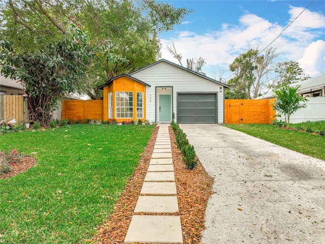 view of front facade with a garage and a front lawn