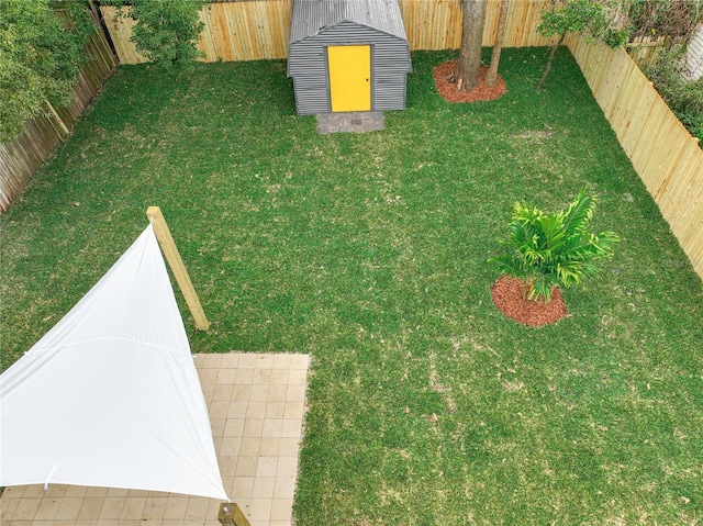 view of yard with a storage shed and central AC