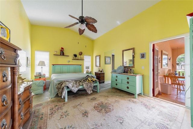 bedroom featuring multiple windows, lofted ceiling, and ceiling fan