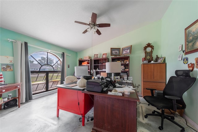 home office featuring ceiling fan, lofted ceiling, and a textured ceiling