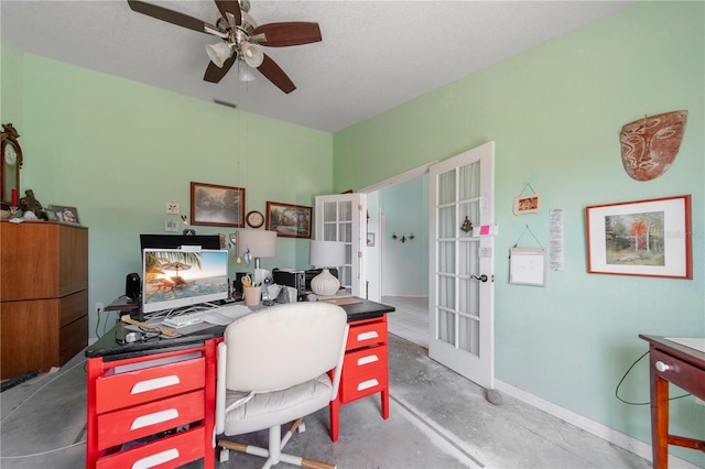 home office with french doors, ceiling fan, and concrete floors