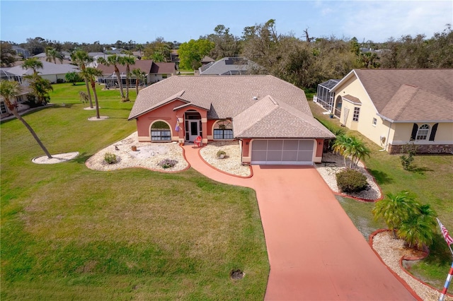 view of front of house featuring a garage and a front yard