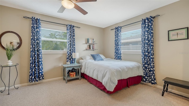 bedroom with carpet floors, baseboards, and a ceiling fan