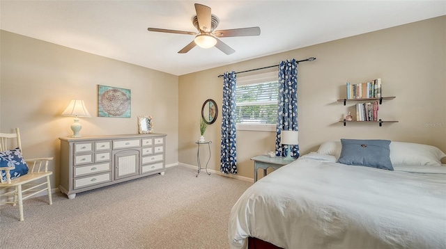 bedroom featuring carpet flooring, a ceiling fan, and baseboards