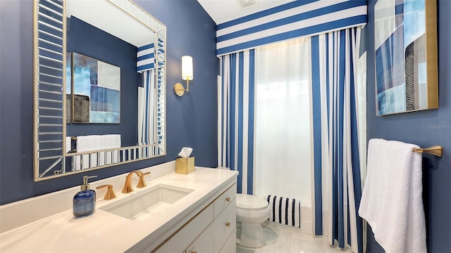 full bathroom featuring vanity, toilet, and tile patterned floors