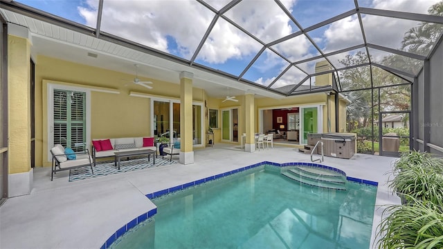 outdoor pool with outdoor lounge area, a hot tub, a patio area, ceiling fan, and a lanai