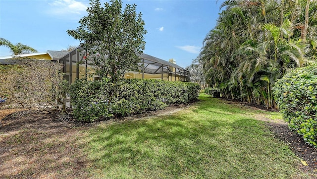 view of yard with a lanai