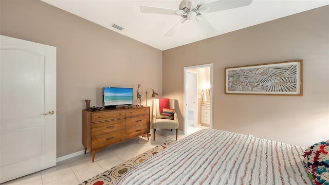 bedroom with light tile patterned flooring, a ceiling fan, visible vents, baseboards, and ensuite bath