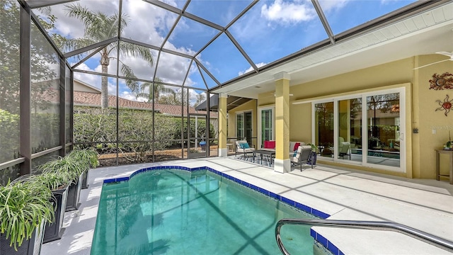 outdoor pool featuring a lanai and a patio area