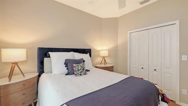 bedroom with ceiling fan, a closet, and visible vents