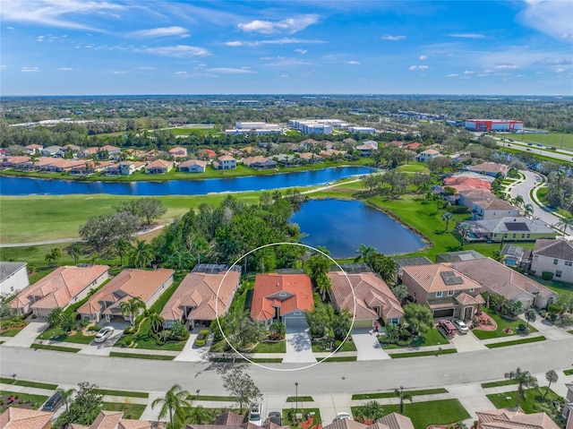 birds eye view of property with a residential view and a water view