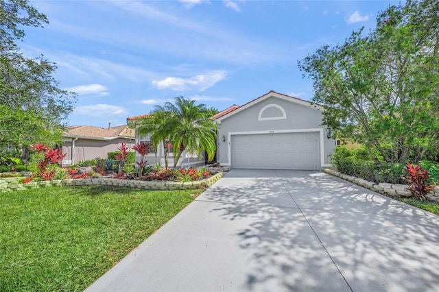 8956 Stone Harbour Loop, Bradenton, FL 34212 - view of front facade with an attached garage, driveway, a front yard, and stucco siding