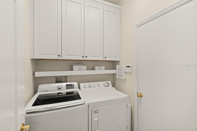 8956 Stone Harbour Loop, Bradenton, FL 34212 - laundry area with cabinet space and washing machine and clothes dryer