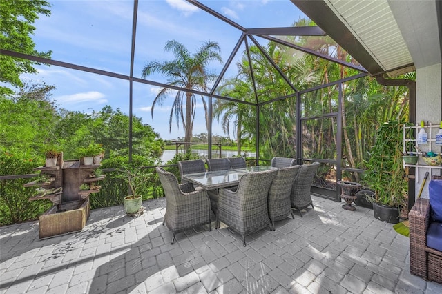 8956 Stone Harbour Loop, Bradenton, FL 34212 - view of patio with outdoor dining area, a lanai, and a water view