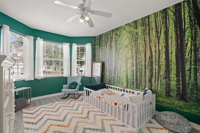 8956 Stone Harbour Loop, Bradenton, FL 34212 - bedroom with a ceiling fan, baseboards, and wood finished floors