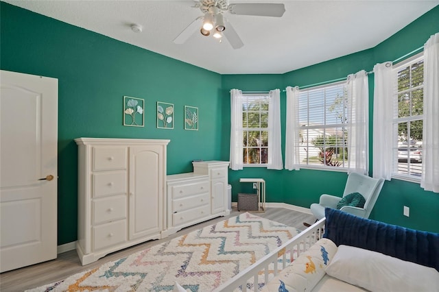 8956 Stone Harbour Loop, Bradenton, FL 34212 - bedroom with baseboards, ceiling fan, and wood finished floors