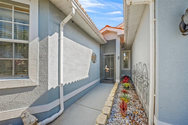 8956 Stone Harbour Loop, Bradenton, FL 34212 - view of exterior entry featuring stucco siding