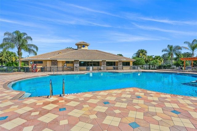 8956 Stone Harbour Loop, Bradenton, FL 34212 - community pool with a patio and fence