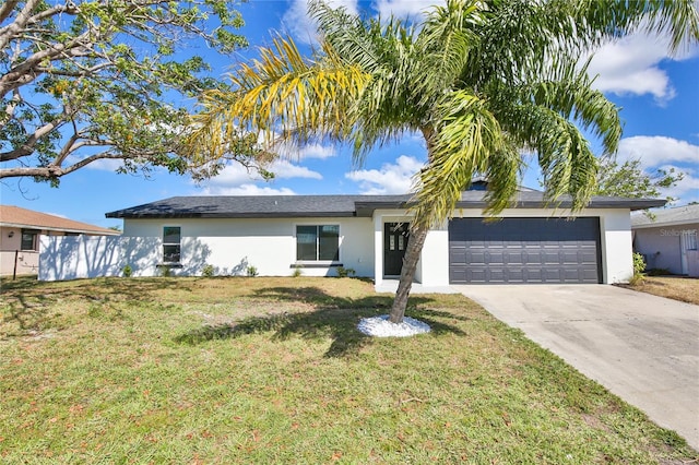 ranch-style home featuring a front lawn and a garage