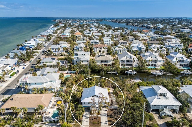 bird's eye view featuring a residential view and a water view