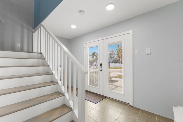 entryway featuring stairs, french doors, recessed lighting, and tile patterned floors