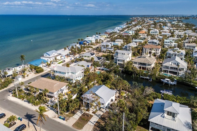 bird's eye view featuring a water view and a residential view