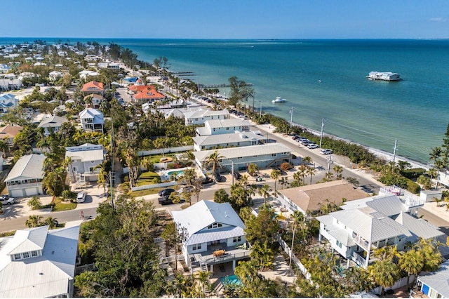 drone / aerial view featuring a residential view and a water view