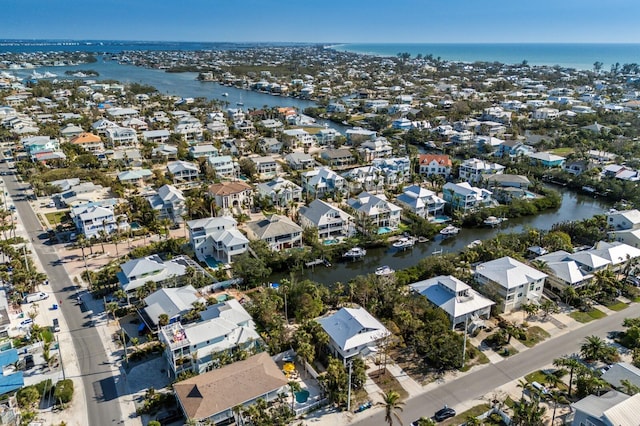 aerial view with a water view and a residential view