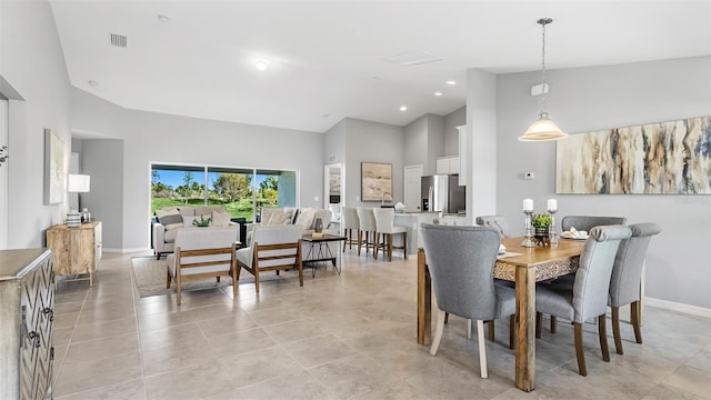 dining area with light tile patterned floors, visible vents, baseboards, high vaulted ceiling, and recessed lighting