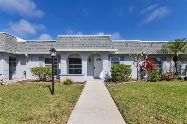 ranch-style house featuring a front yard