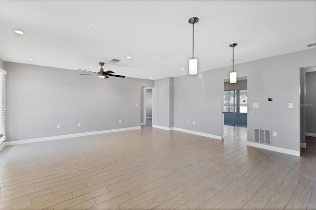 unfurnished living room with light hardwood / wood-style flooring and ceiling fan