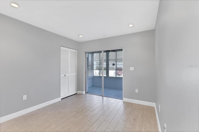spare room featuring light hardwood / wood-style flooring