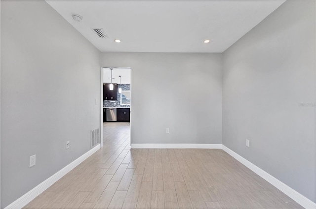 empty room with light hardwood / wood-style floors