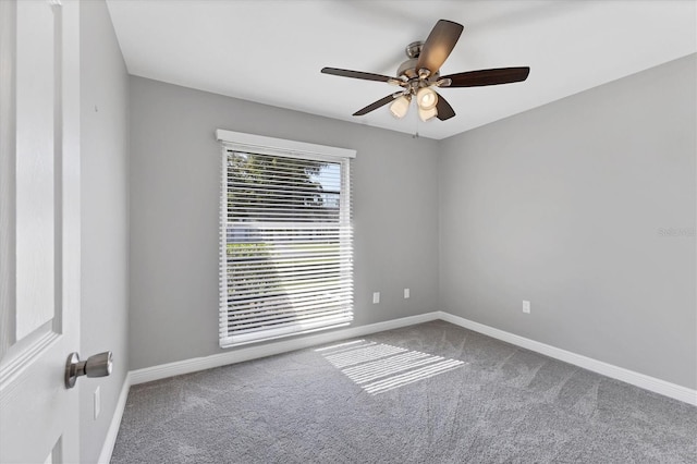 carpeted empty room with ceiling fan