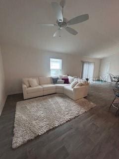 unfurnished living room featuring ceiling fan and dark hardwood / wood-style floors