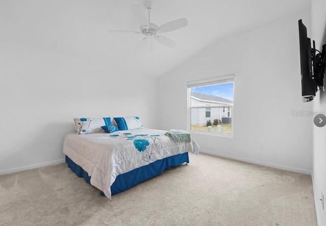 carpeted bedroom featuring ceiling fan and lofted ceiling