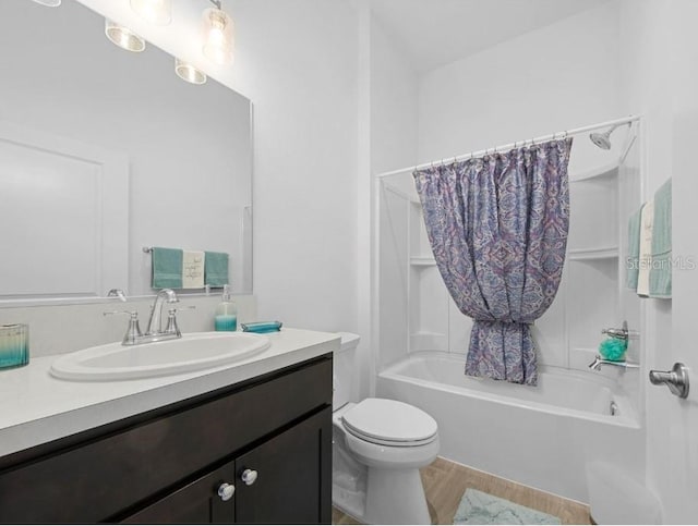 full bathroom featuring shower / bath combination with curtain, vanity, wood-type flooring, and toilet