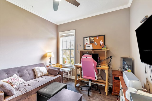 home office with dark wood-type flooring, crown molding, and ceiling fan