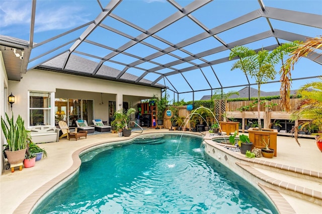 outdoor pool with glass enclosure and a patio