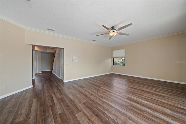 spare room with dark wood-style floors, ornamental molding, ceiling fan, a textured ceiling, and baseboards