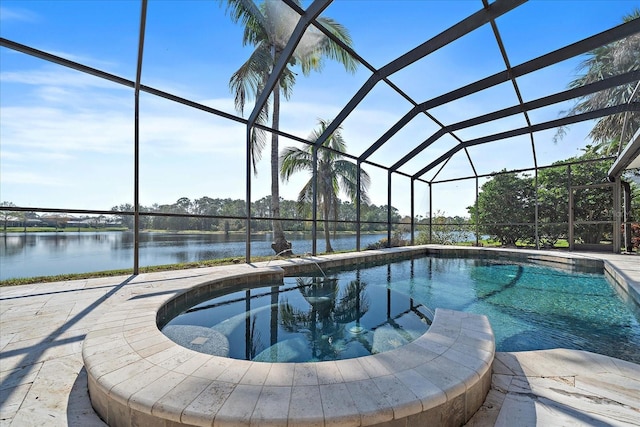 outdoor pool featuring a lanai, a water view, and a patio