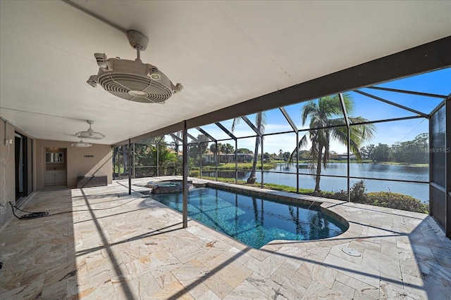 view of pool featuring a patio, a lanai, a water view, a pool with connected hot tub, and a ceiling fan