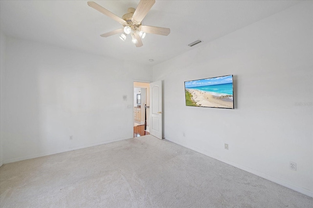 interior space featuring carpet floors, visible vents, and a ceiling fan