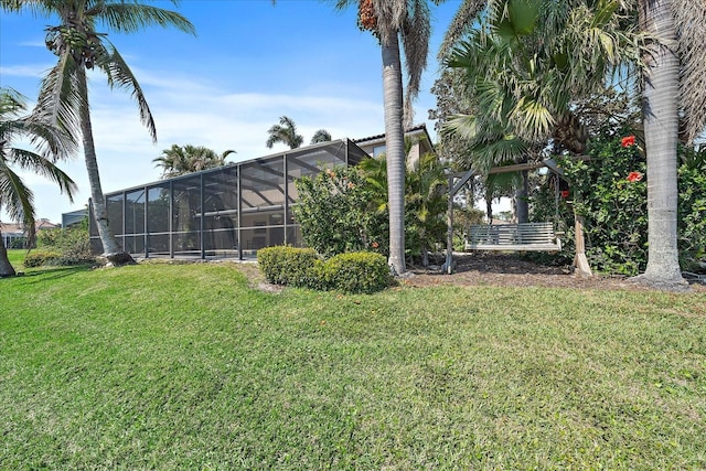 view of yard with glass enclosure