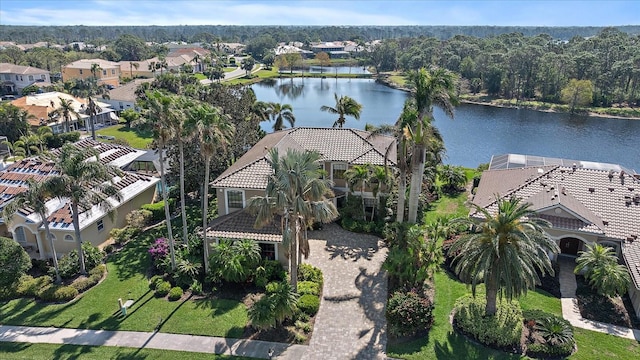 birds eye view of property with a water view and a residential view