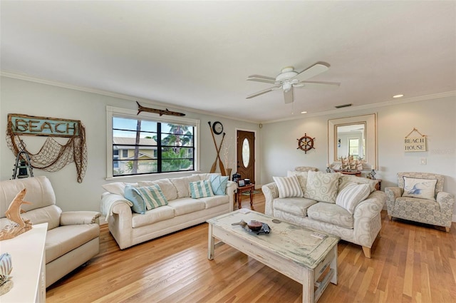 living area featuring light wood-type flooring, ornamental molding, ceiling fan, and recessed lighting