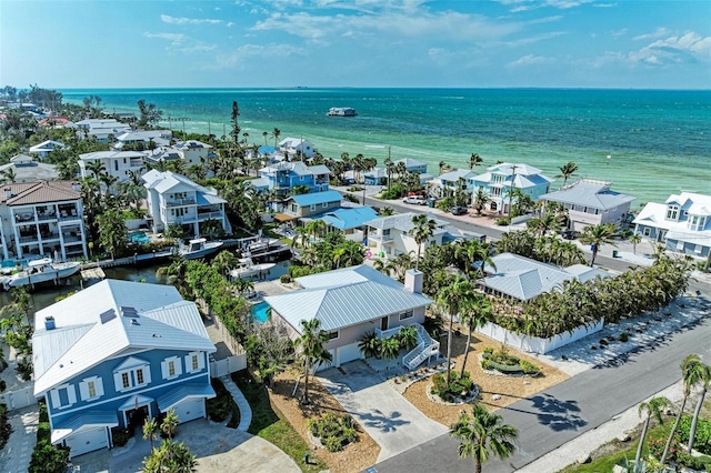 birds eye view of property featuring a residential view and a water view