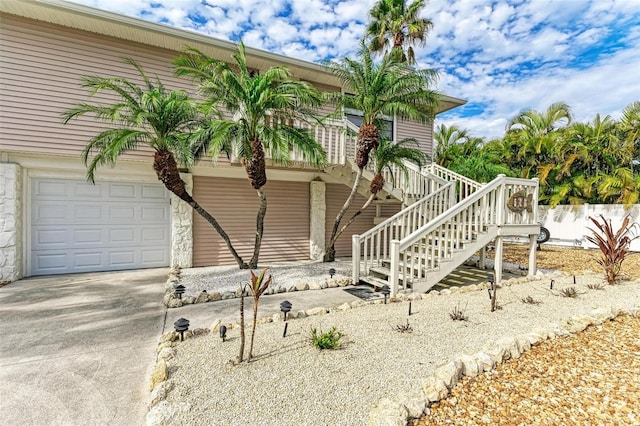 view of home's exterior featuring an attached garage and concrete driveway
