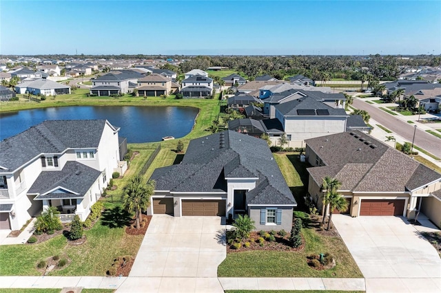 aerial view with a residential view and a water view